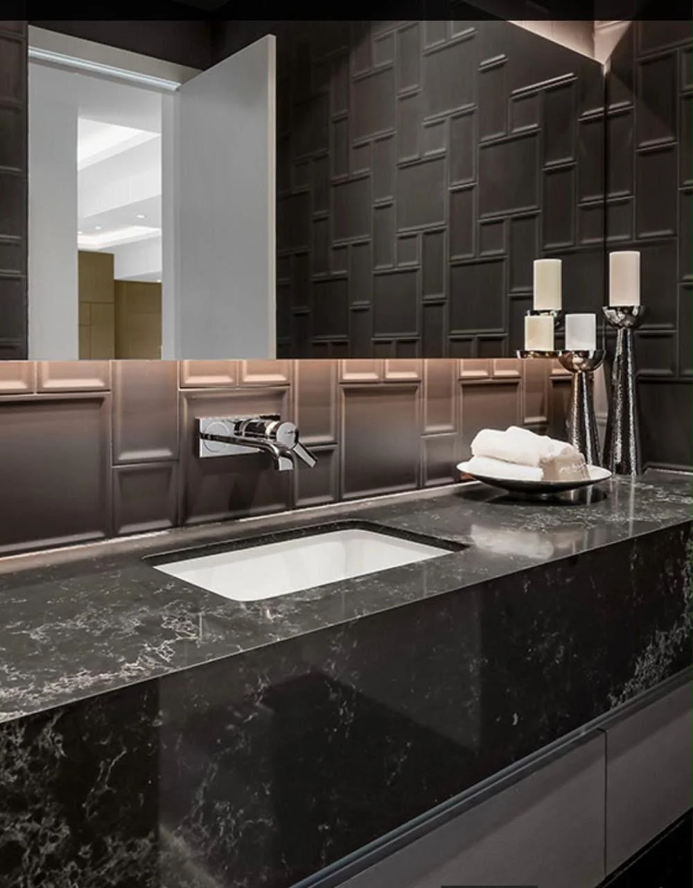 Dark stone bathroom vanity with marble counter by Blocco25